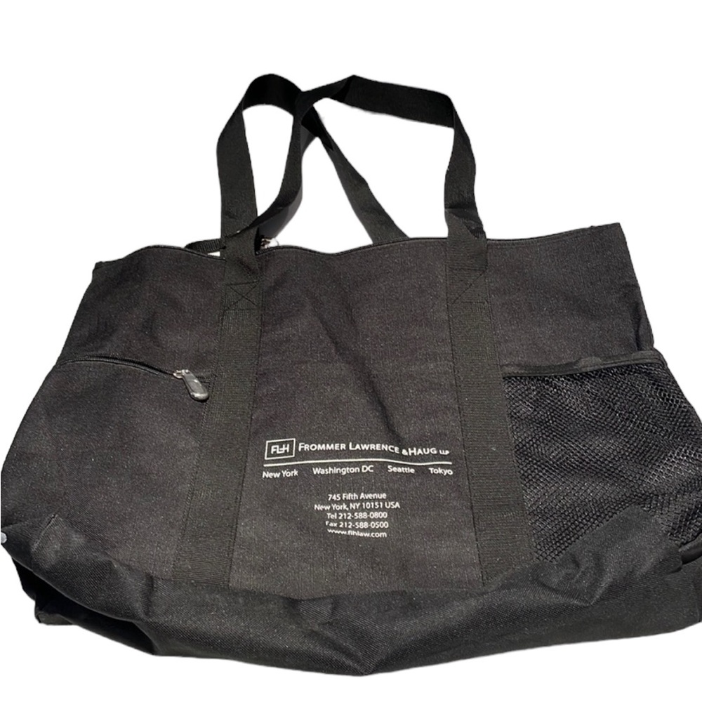 Black canvas zipper tote with three outside pockets. Large. GC.